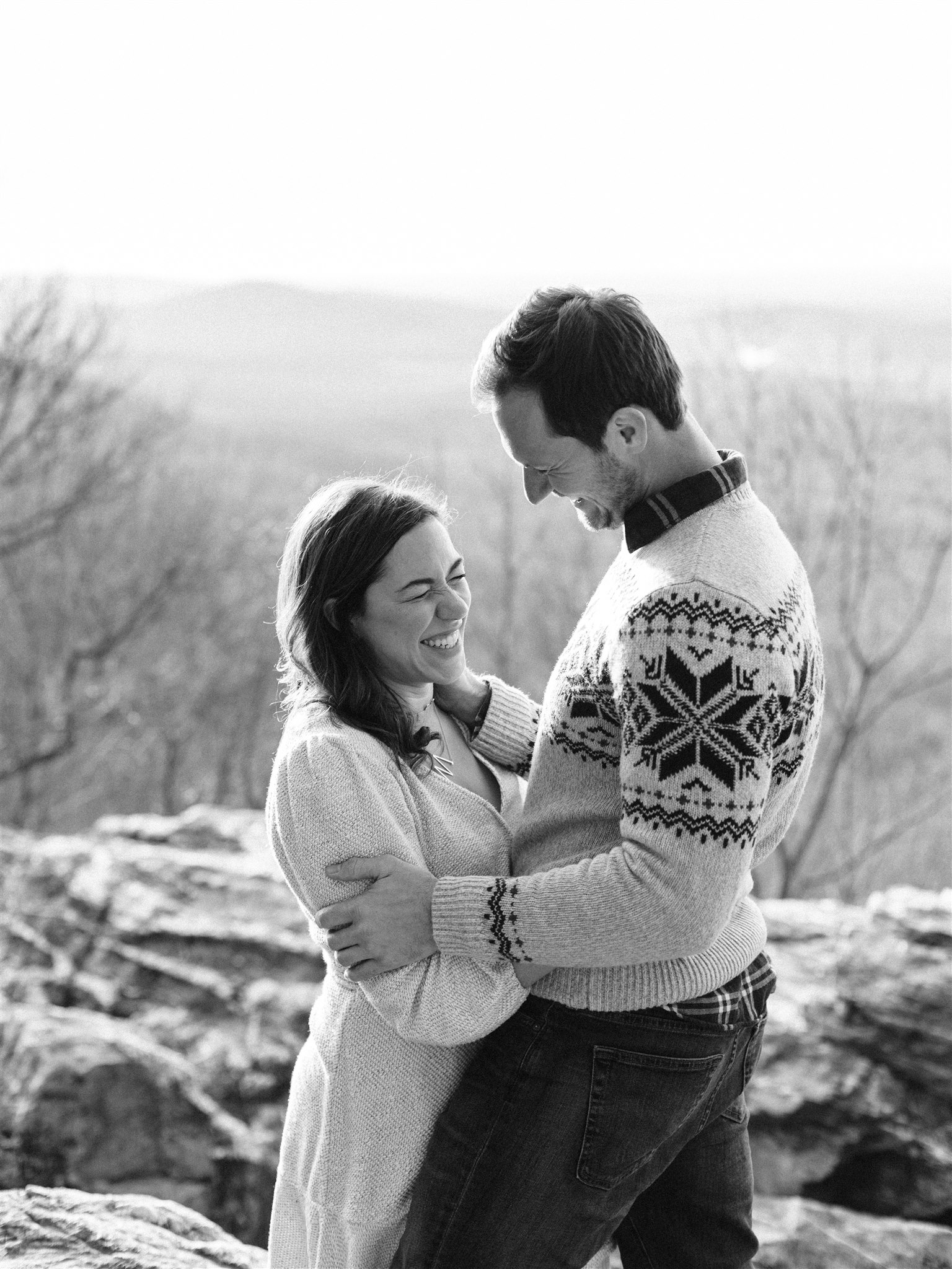 engaged couple laughs during VA engagement photos