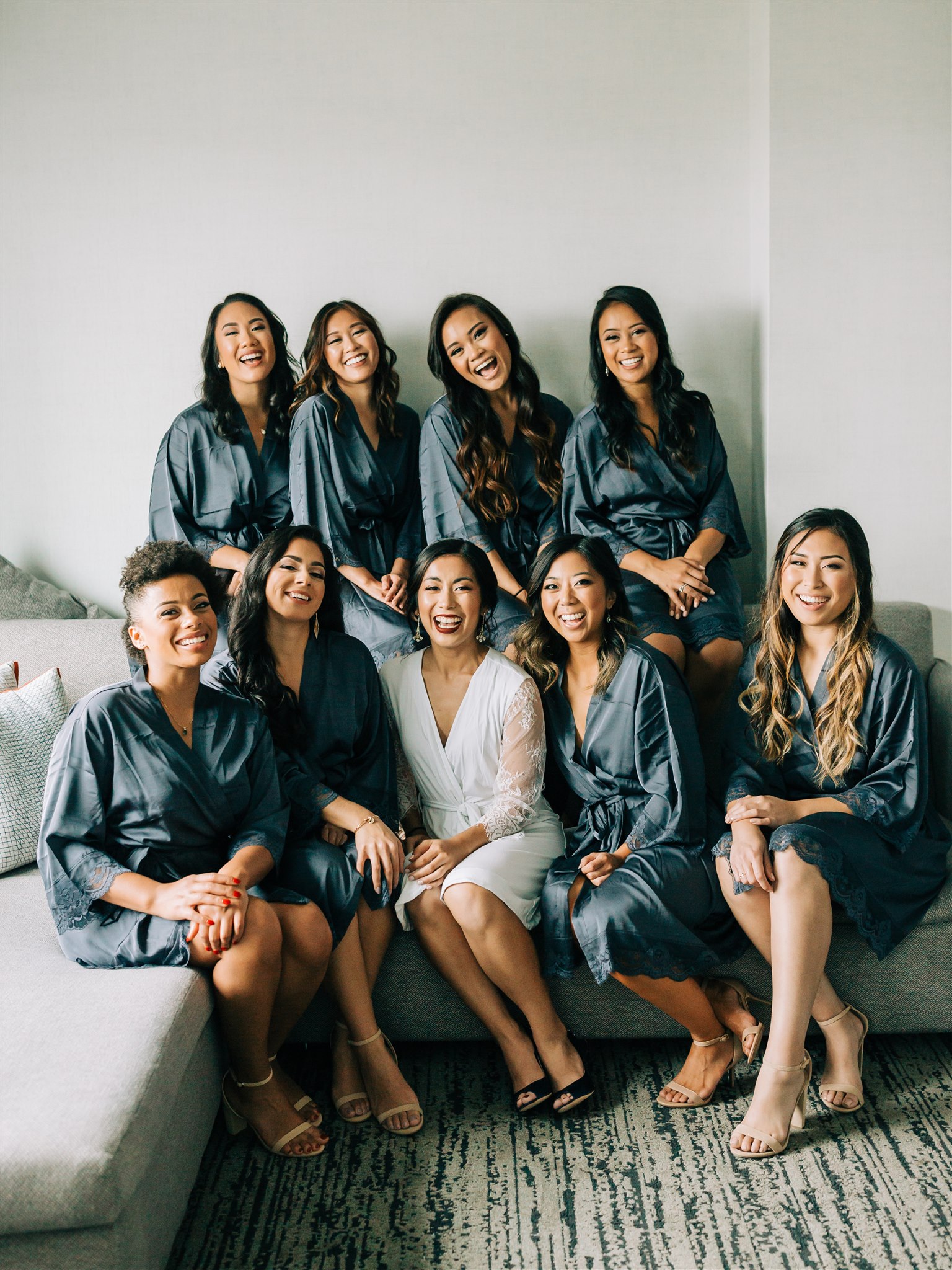 bridesmaids in teal robes prepare for Winery at Bull Run wedding