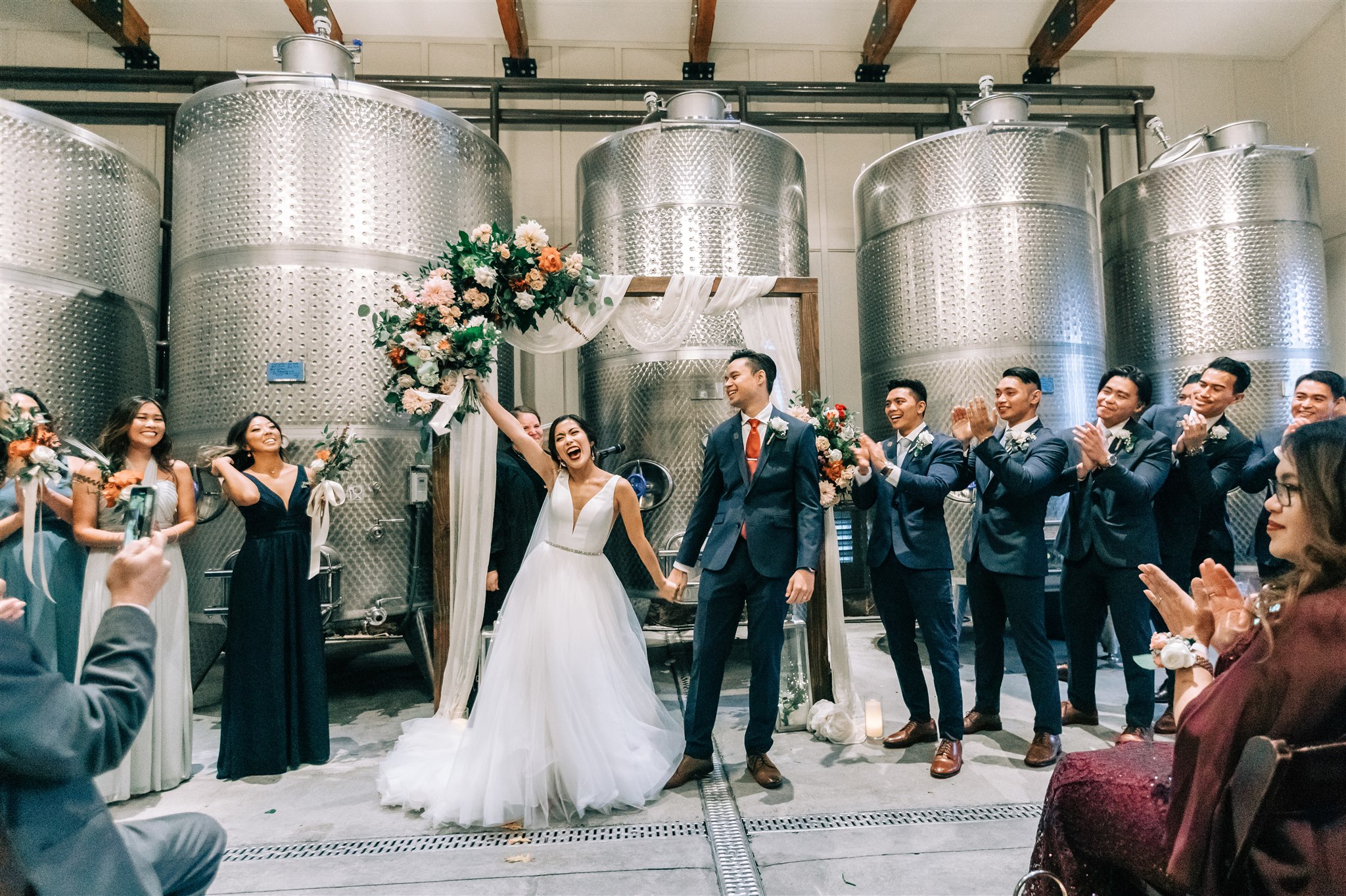 bride cheers after wedding ceremony in VA winery