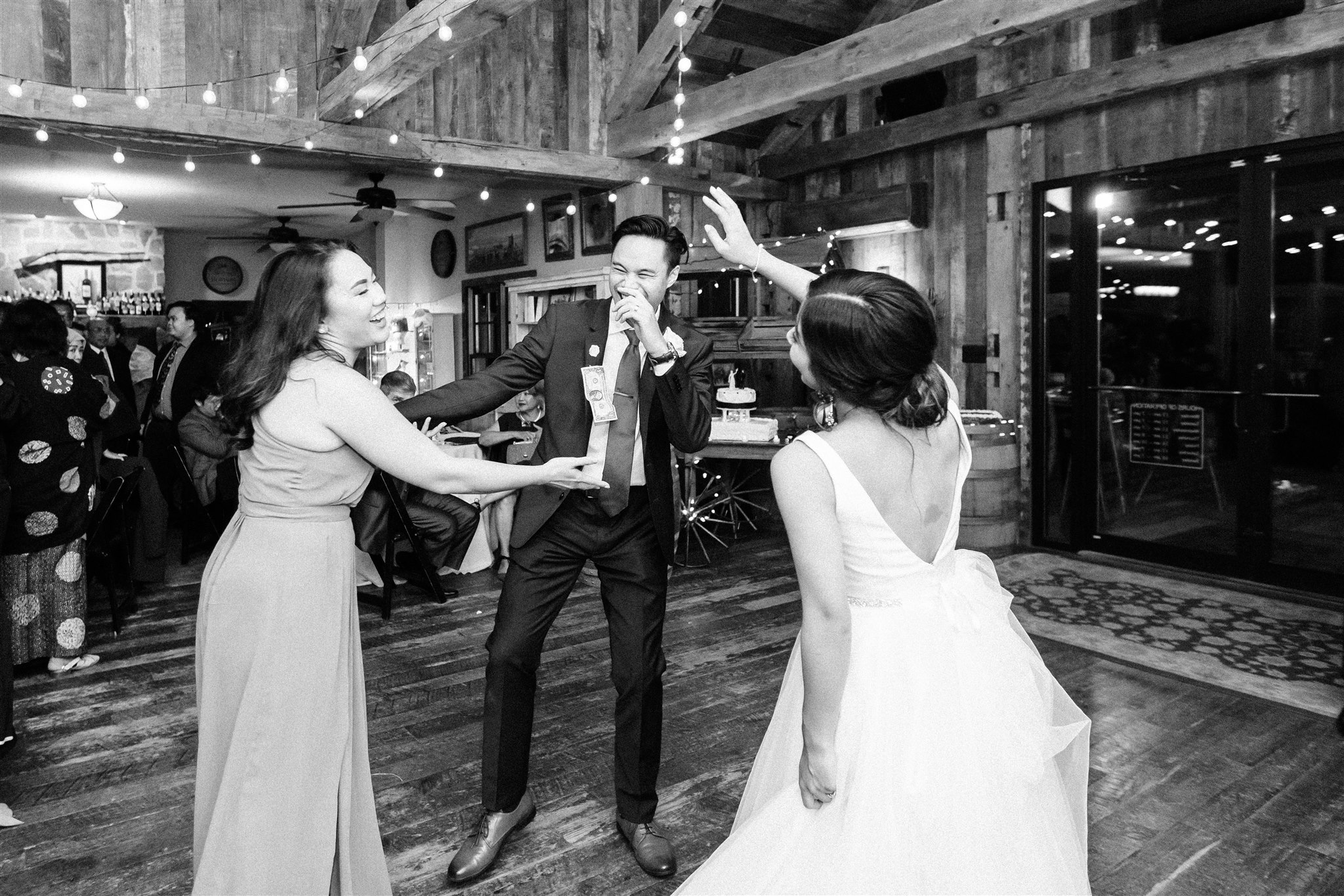 bride and groom dance with guests