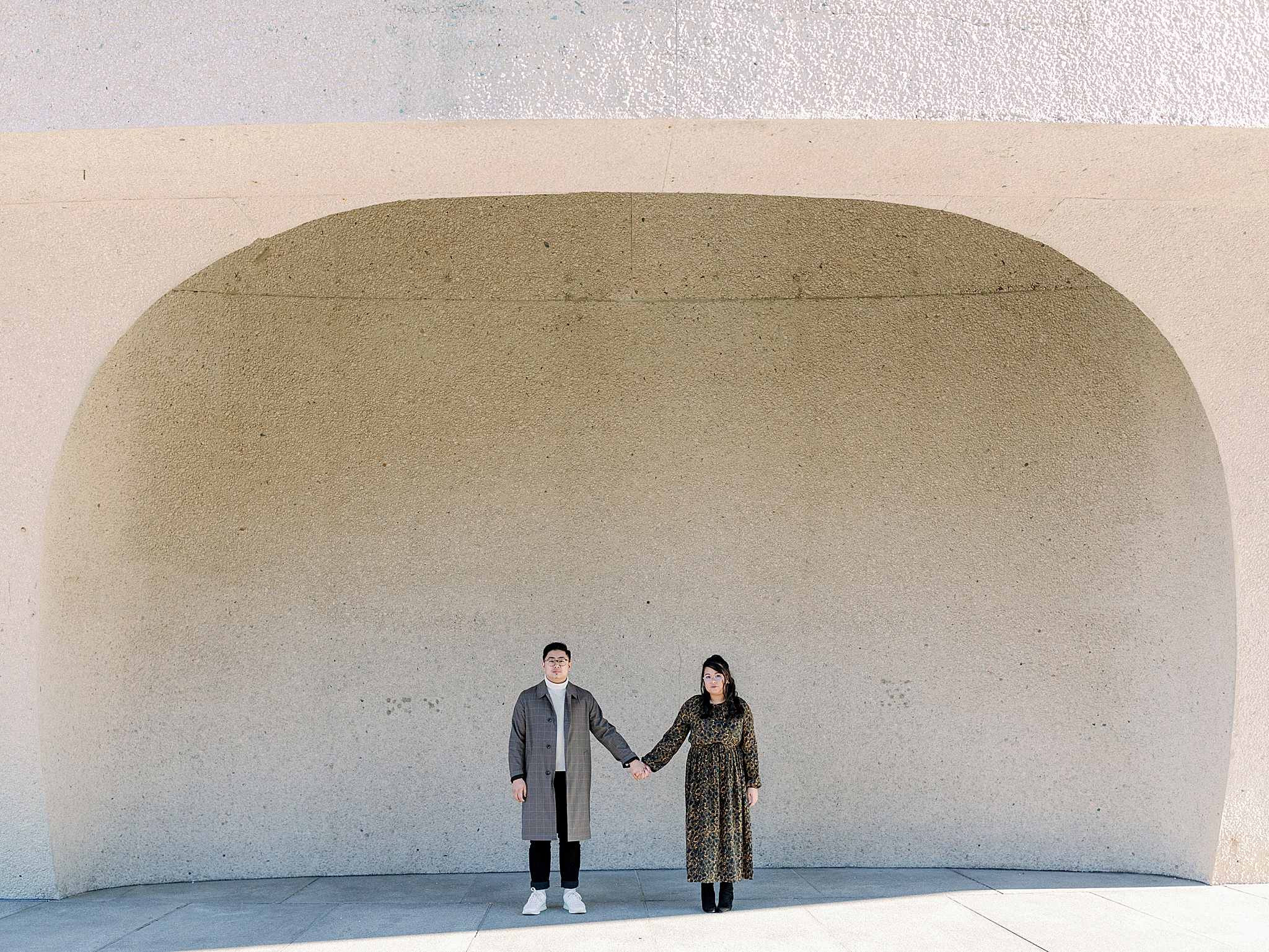 couple poses during modern engagement session