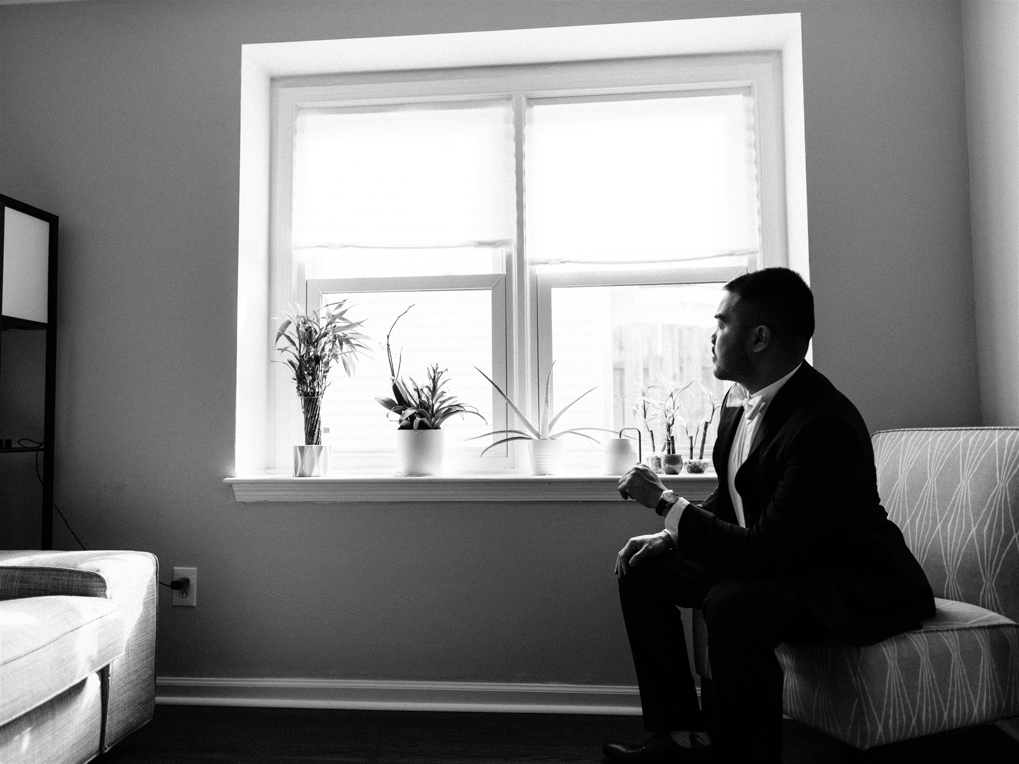 black and white portrait of groom on wedding day