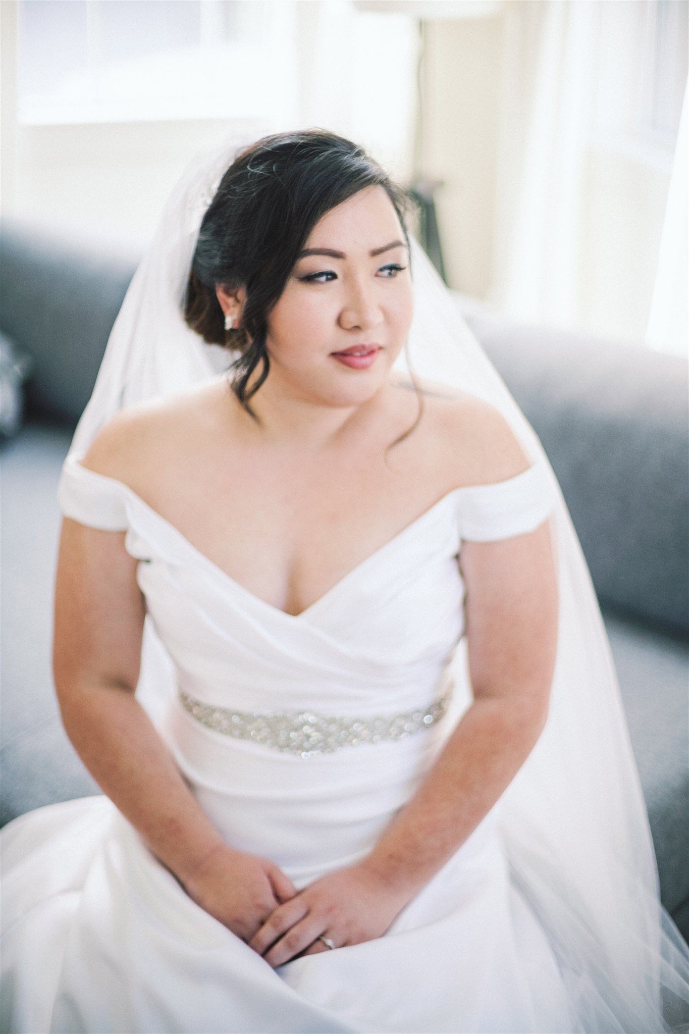 bride sits during classic portrait