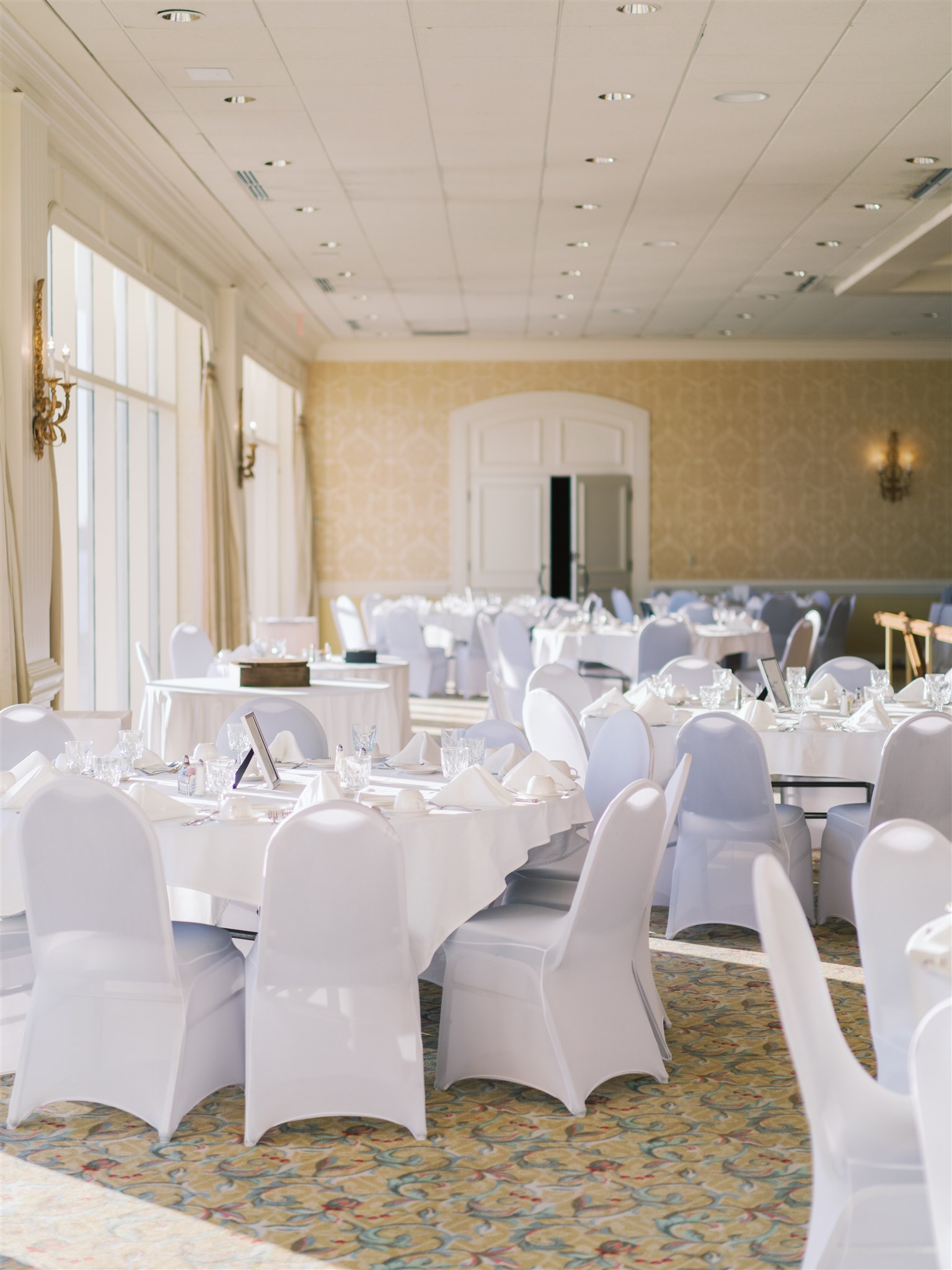 elegant wedding reception seating with white slipcovers