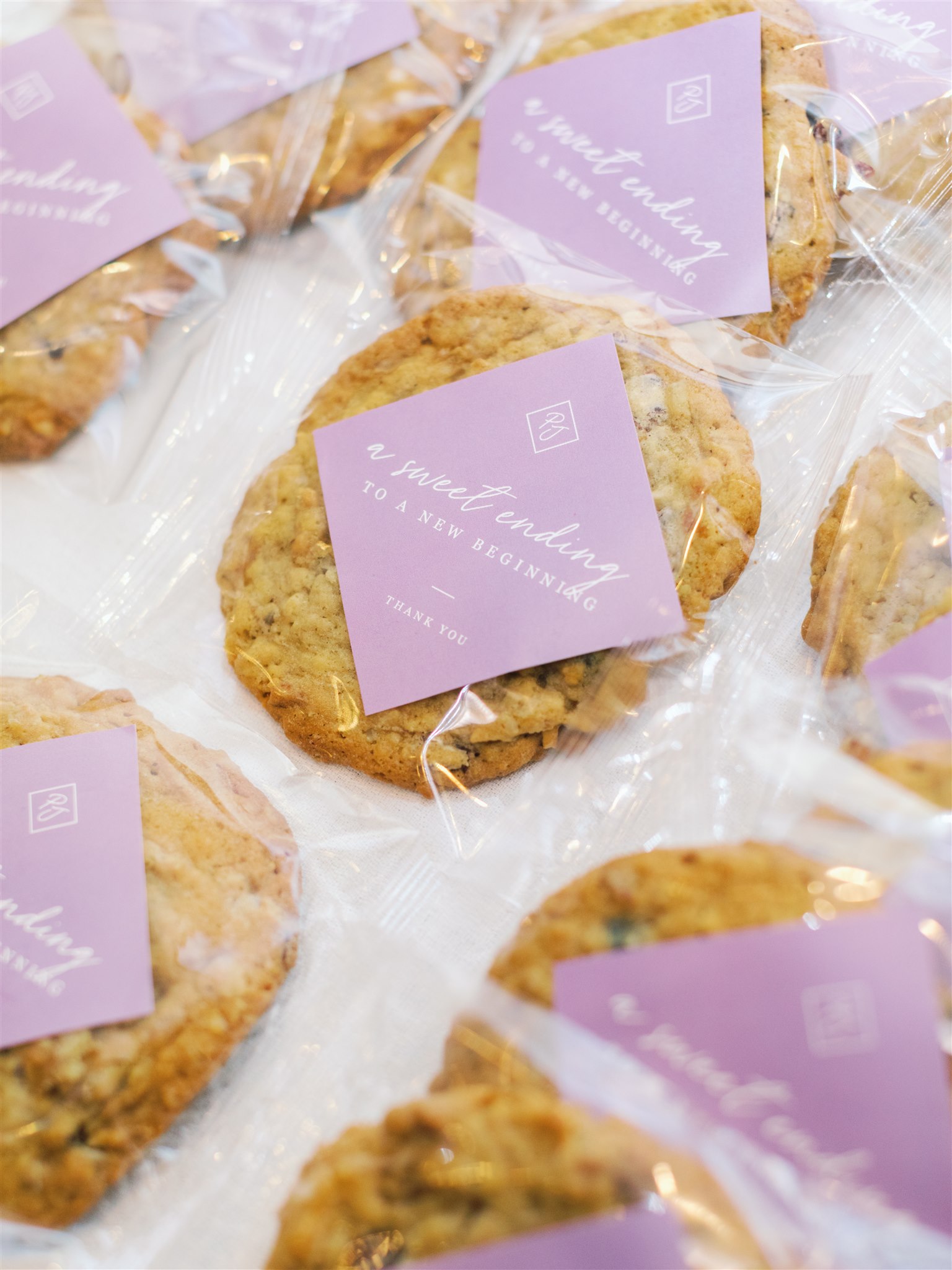 cookies with purple label for wedding reception favors