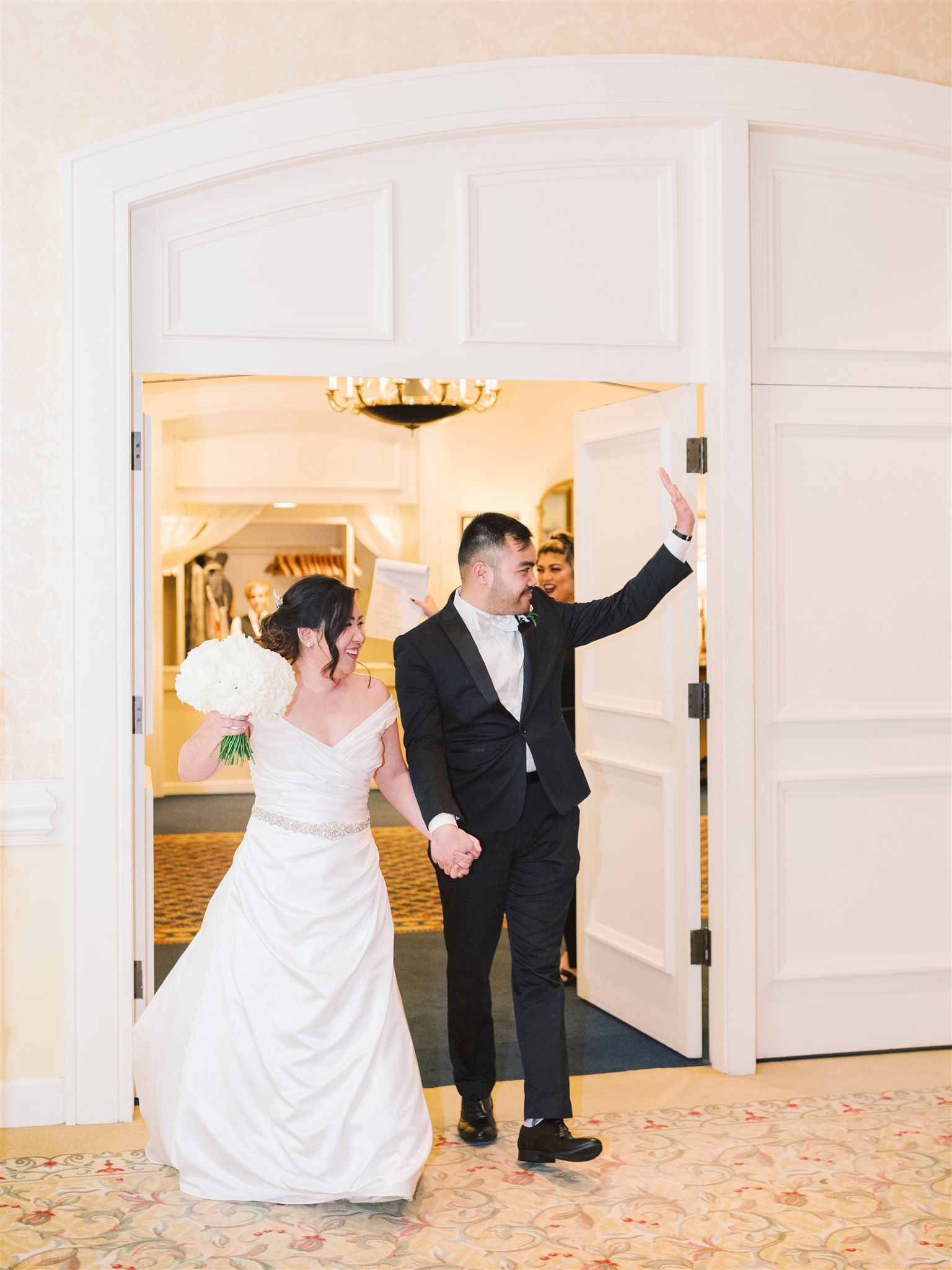 bride and groom enter Norfolk VA wedding reception