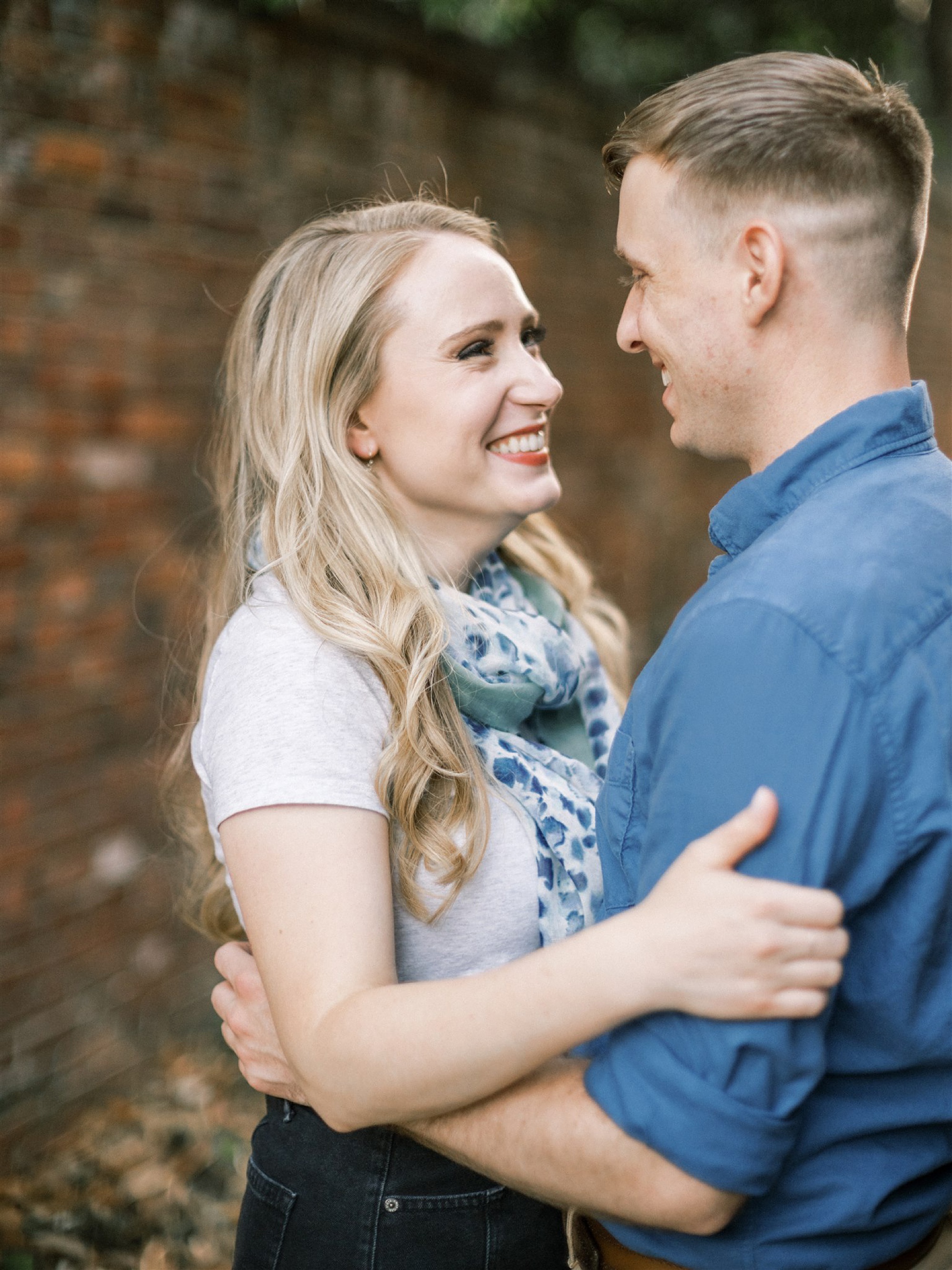 bride looks at groom during Old Town Alexandria engagement session