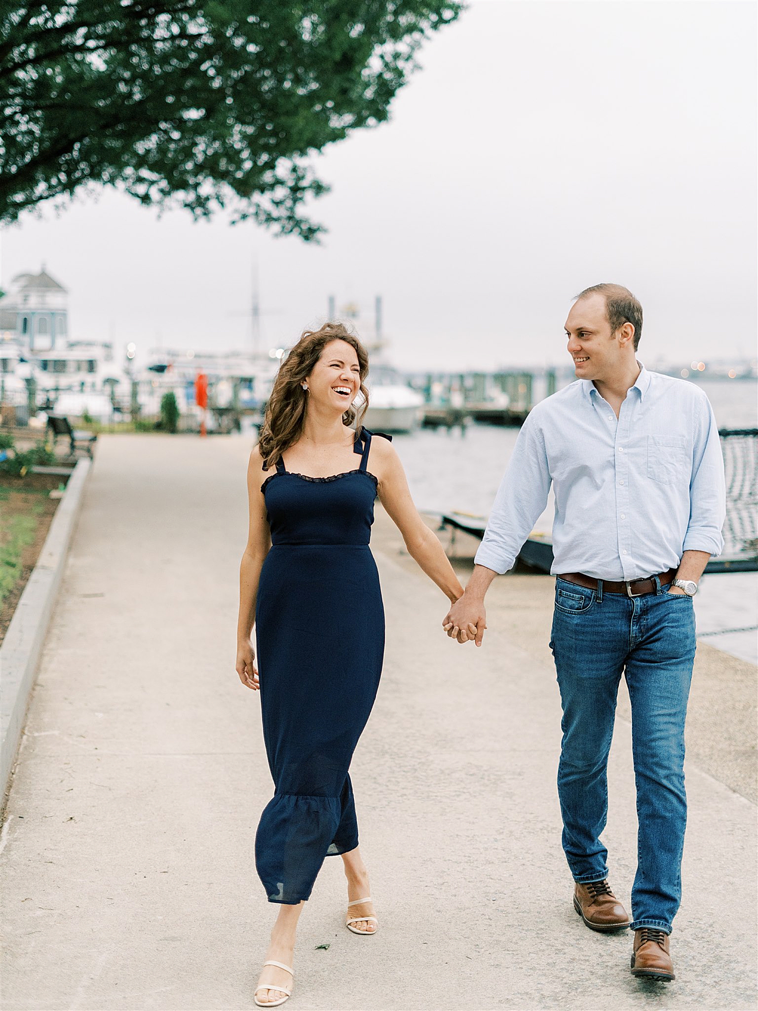 couple walks along marina in Alexandria