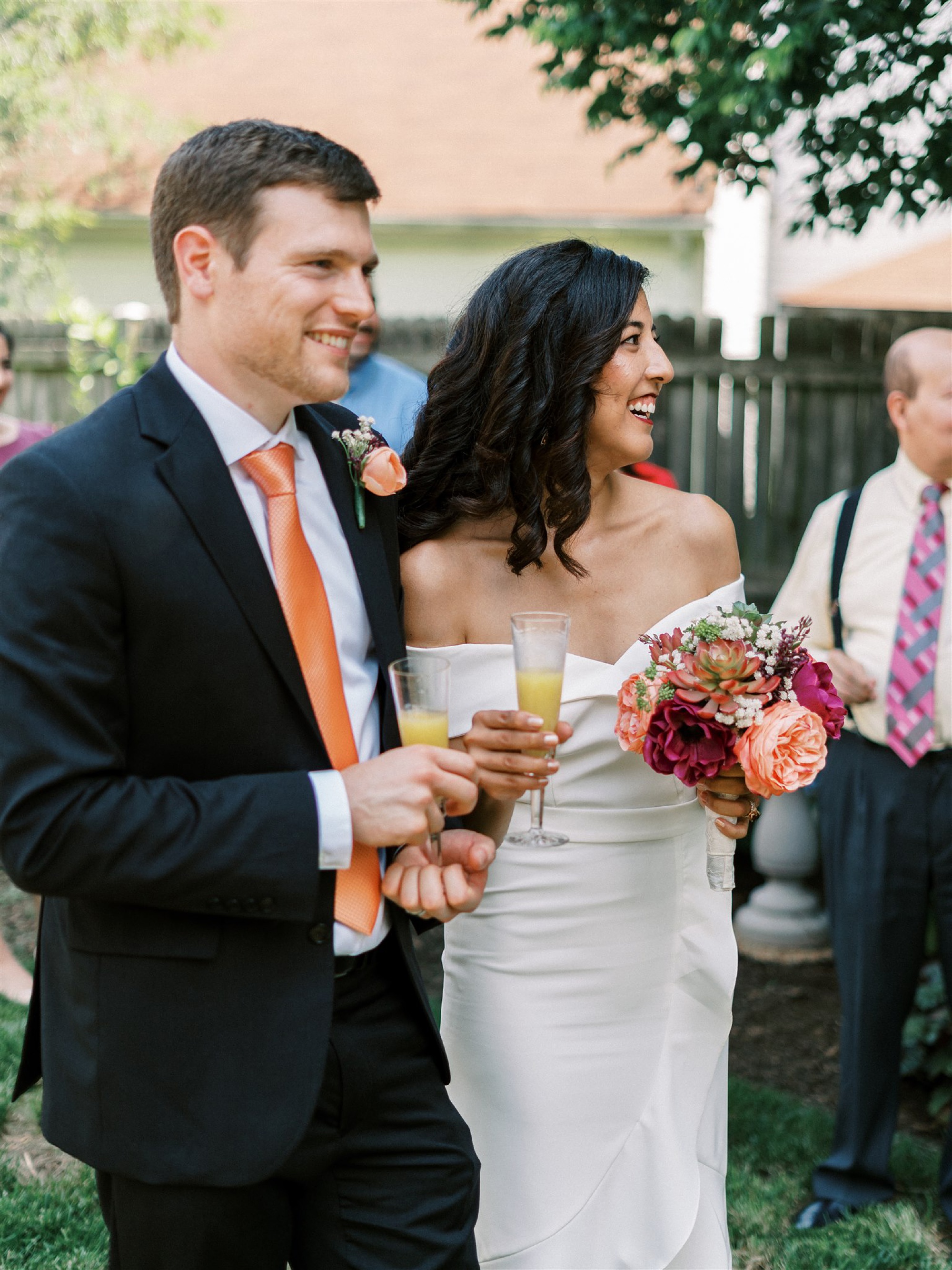 newlyweds mingle with guests during intimate backyard wedding 