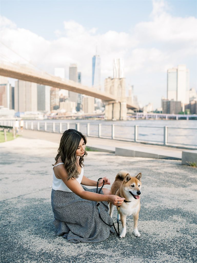 business owner pets dog during NYC branding photos