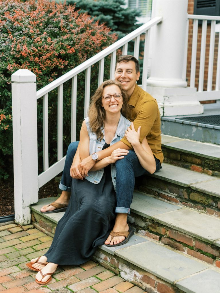 engaged couple sits on steps during VA engagement photos 