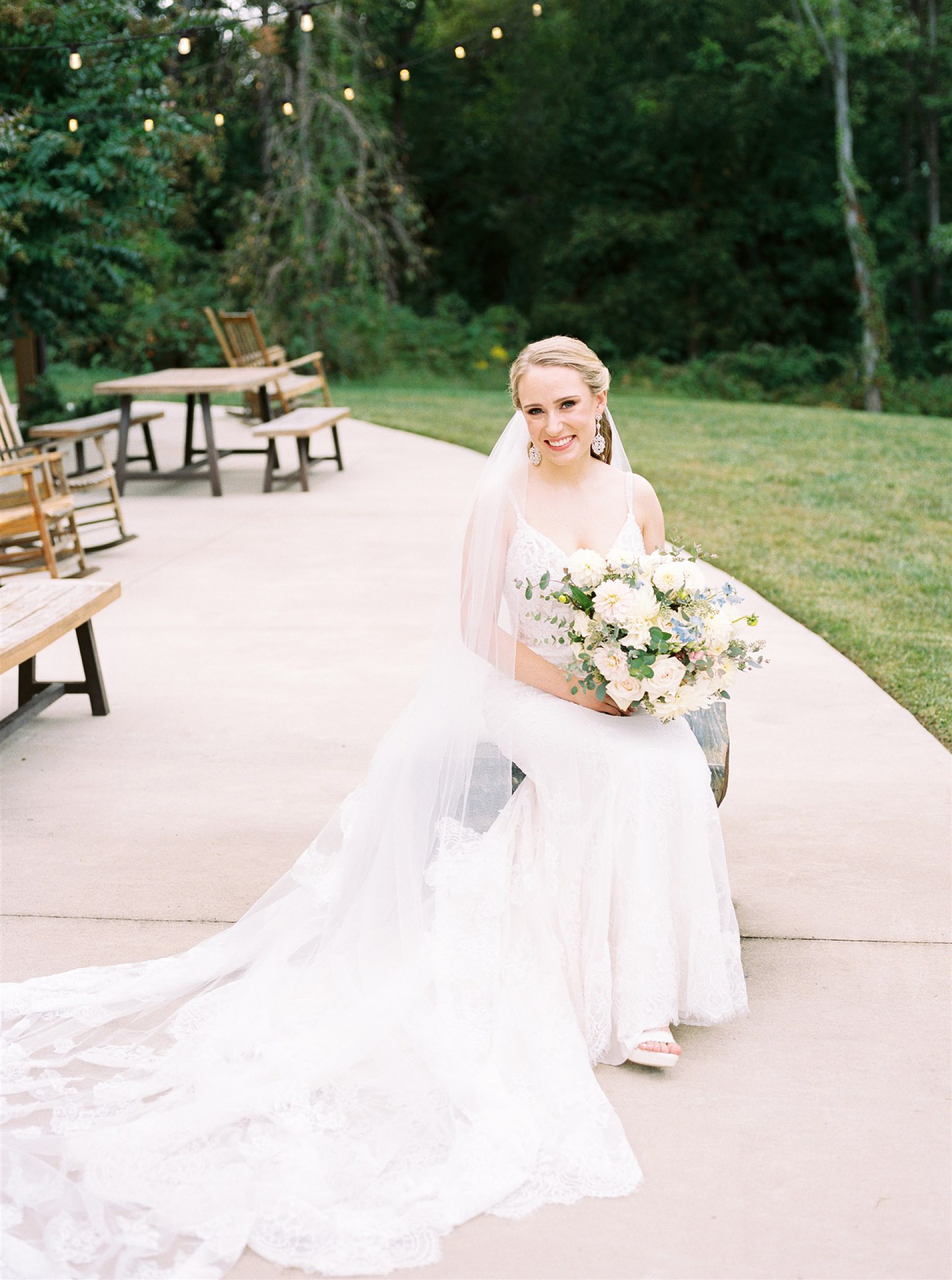 bride poses on patio at Mt Defiance Cidery