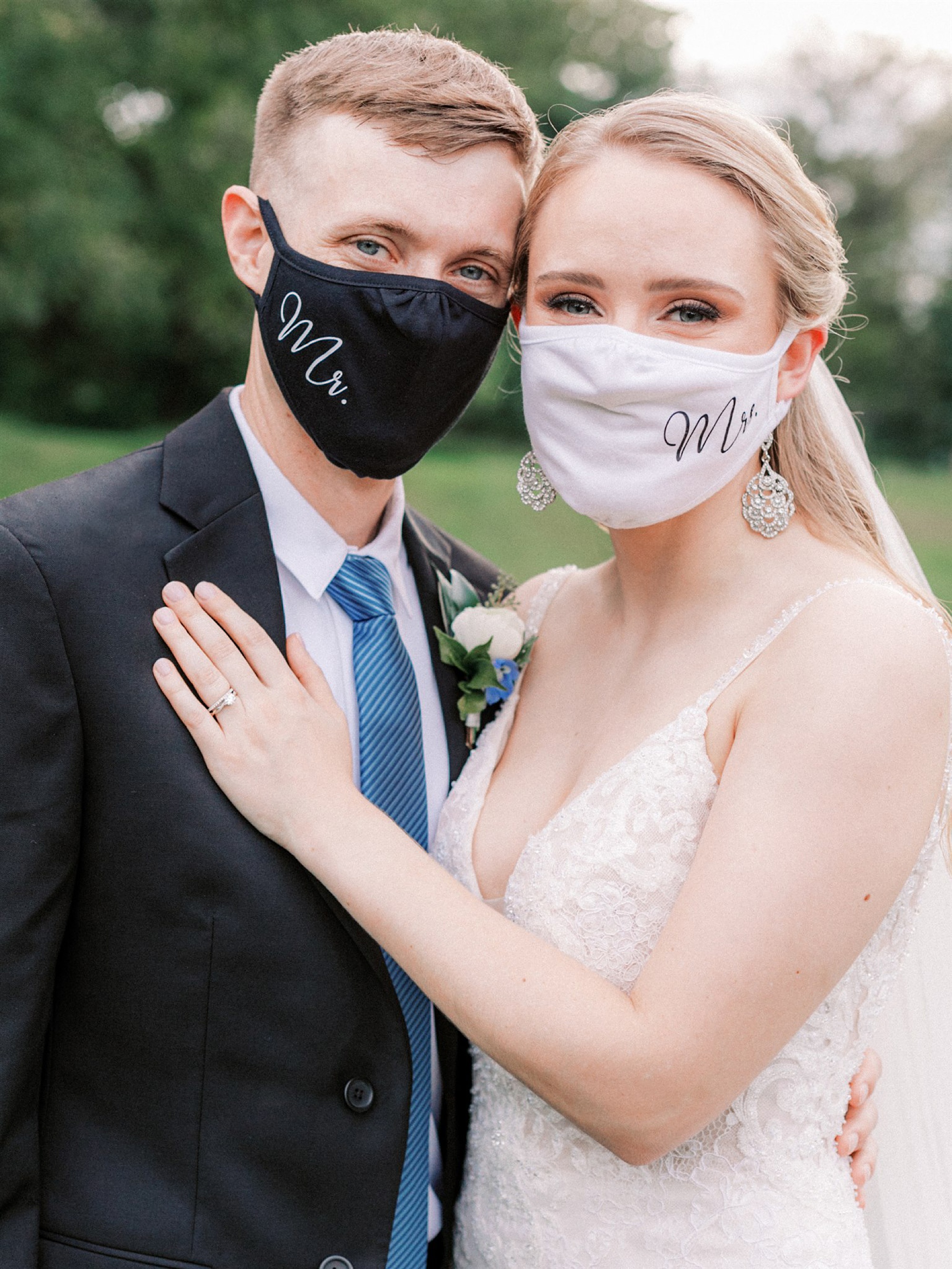 bride and groom in masks pose together during intimate fall wedding at Mt Defiance Cidery