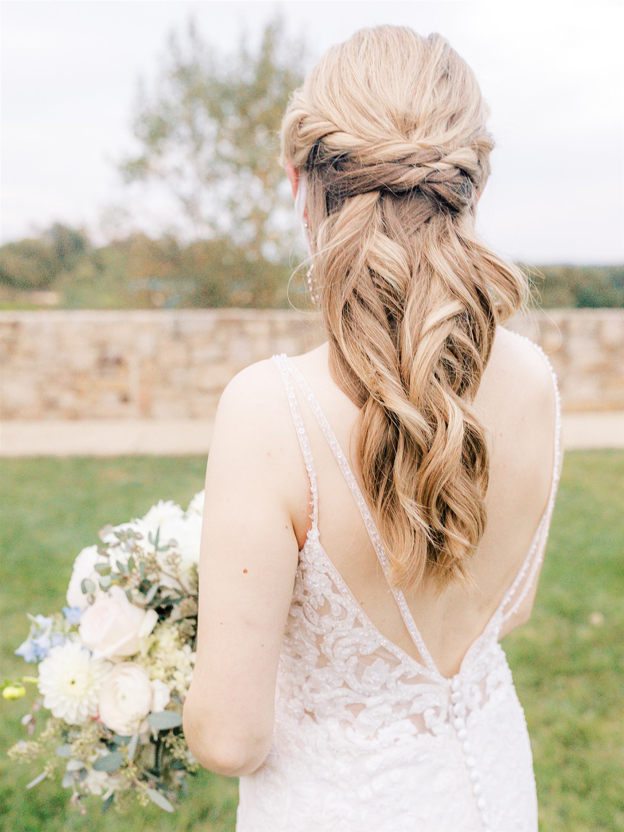 bride shows off hairdo before fall wedding in Middleburg