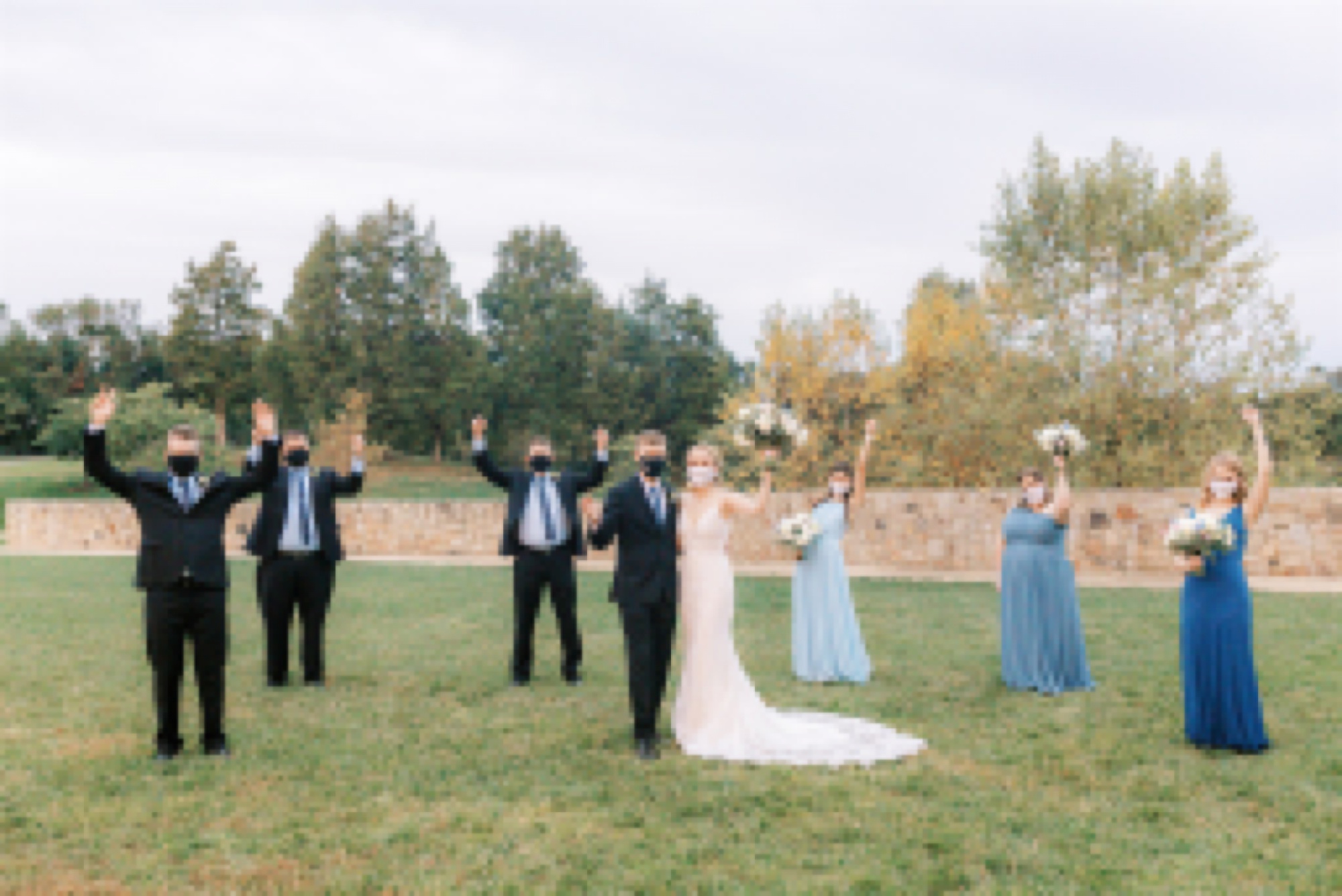 bridal party cheers during wedding portraits in Middleburg VA