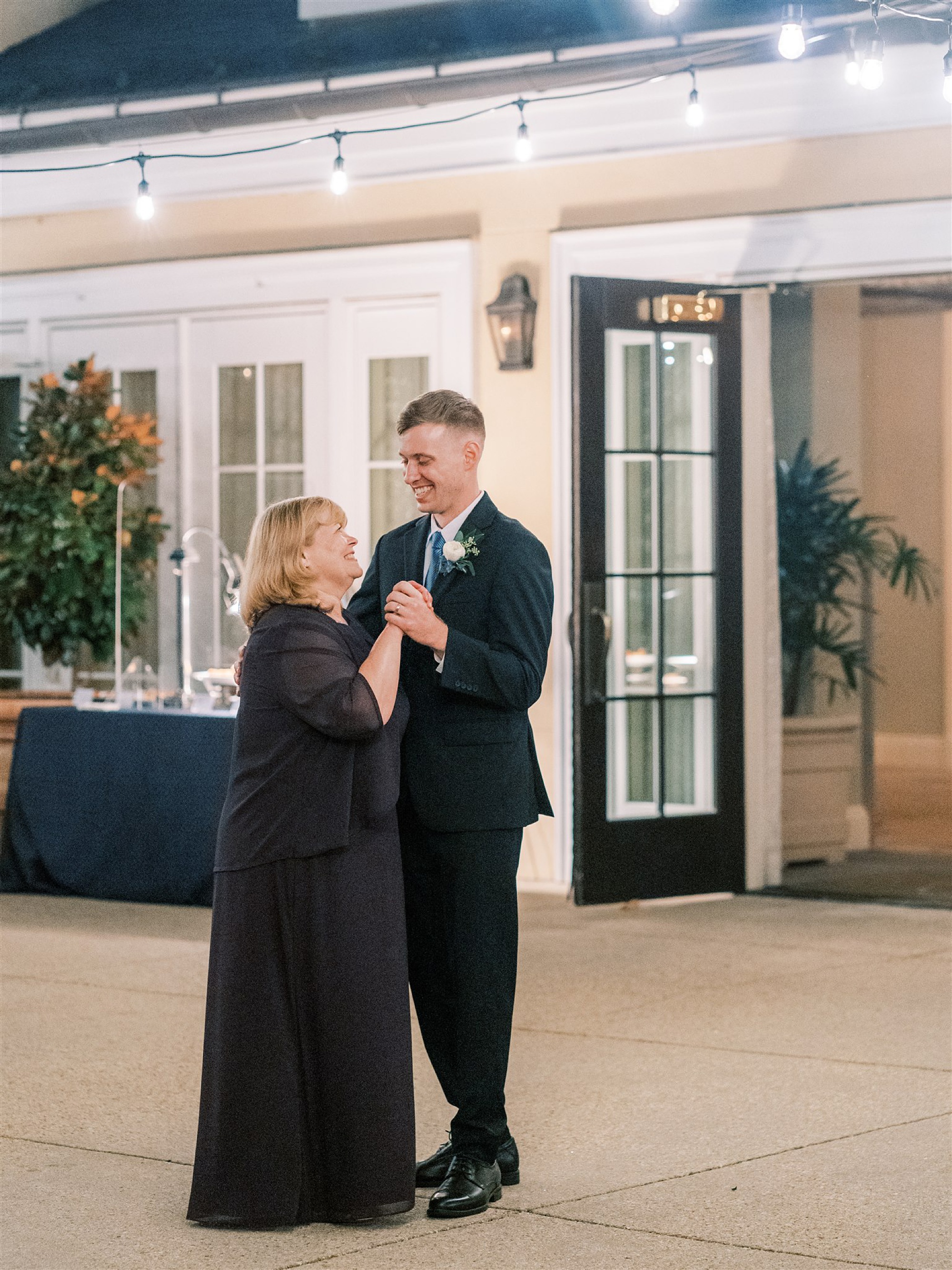groom and mother dance during reception for fall wedding in Middleburg