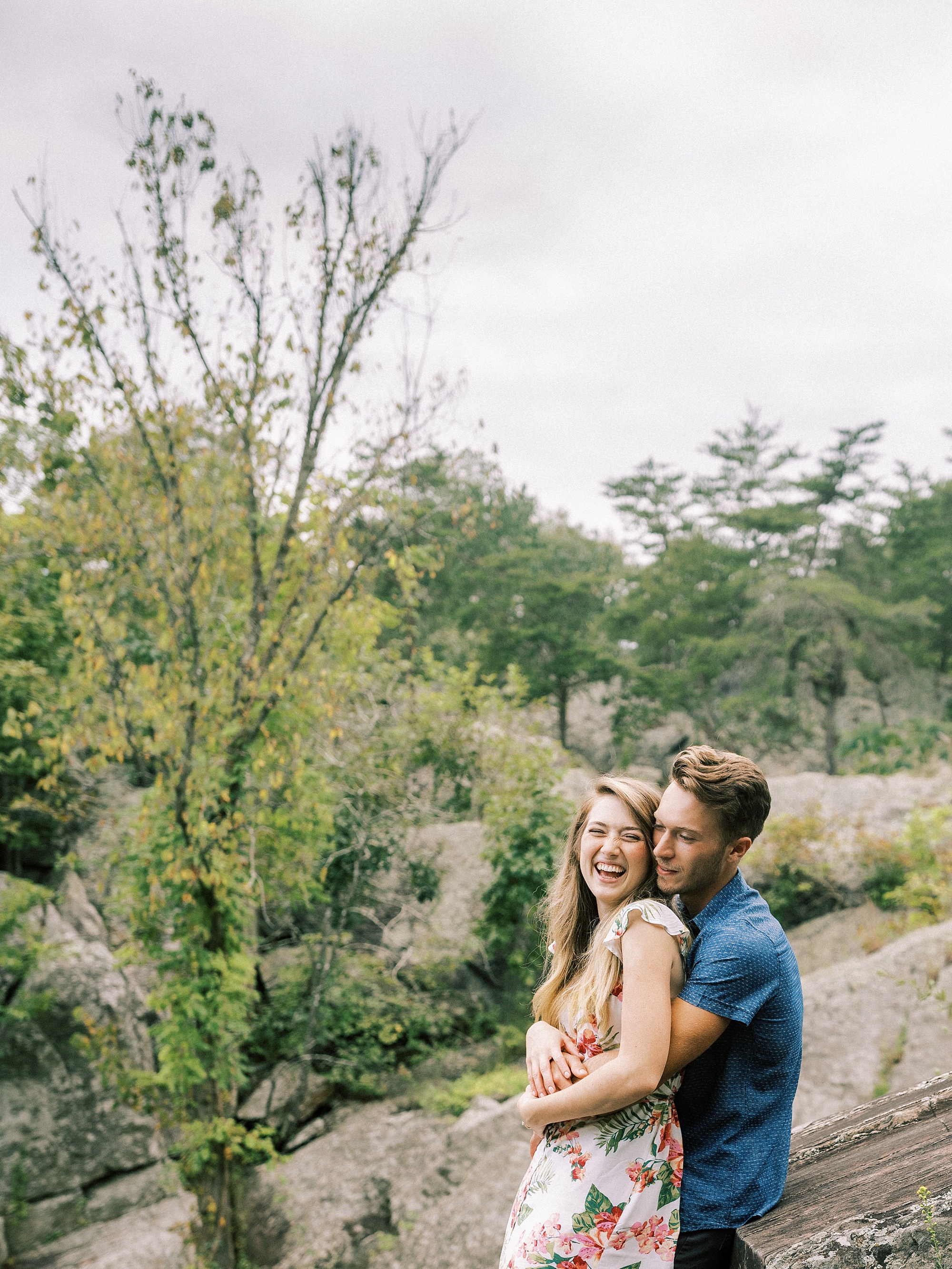 bride and groom laugh during Great Falls Park engagement session