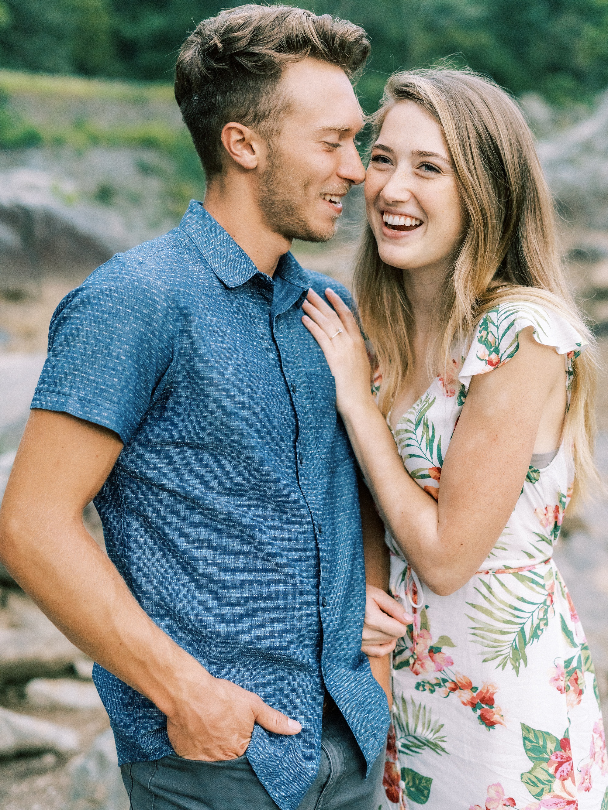 couple laughs during Great Falls Park engagement session