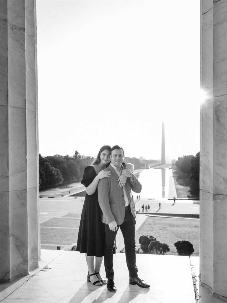 bride and groom pose on steps of Lincoln Memorial