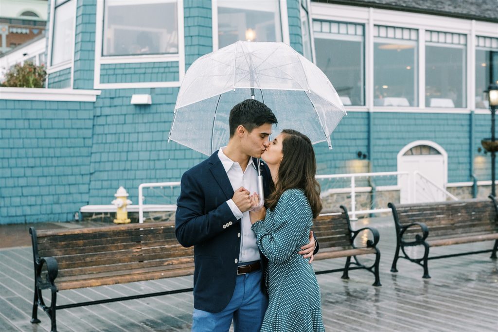 rainy engagement session under clear umbrella in Old Town Alexandria